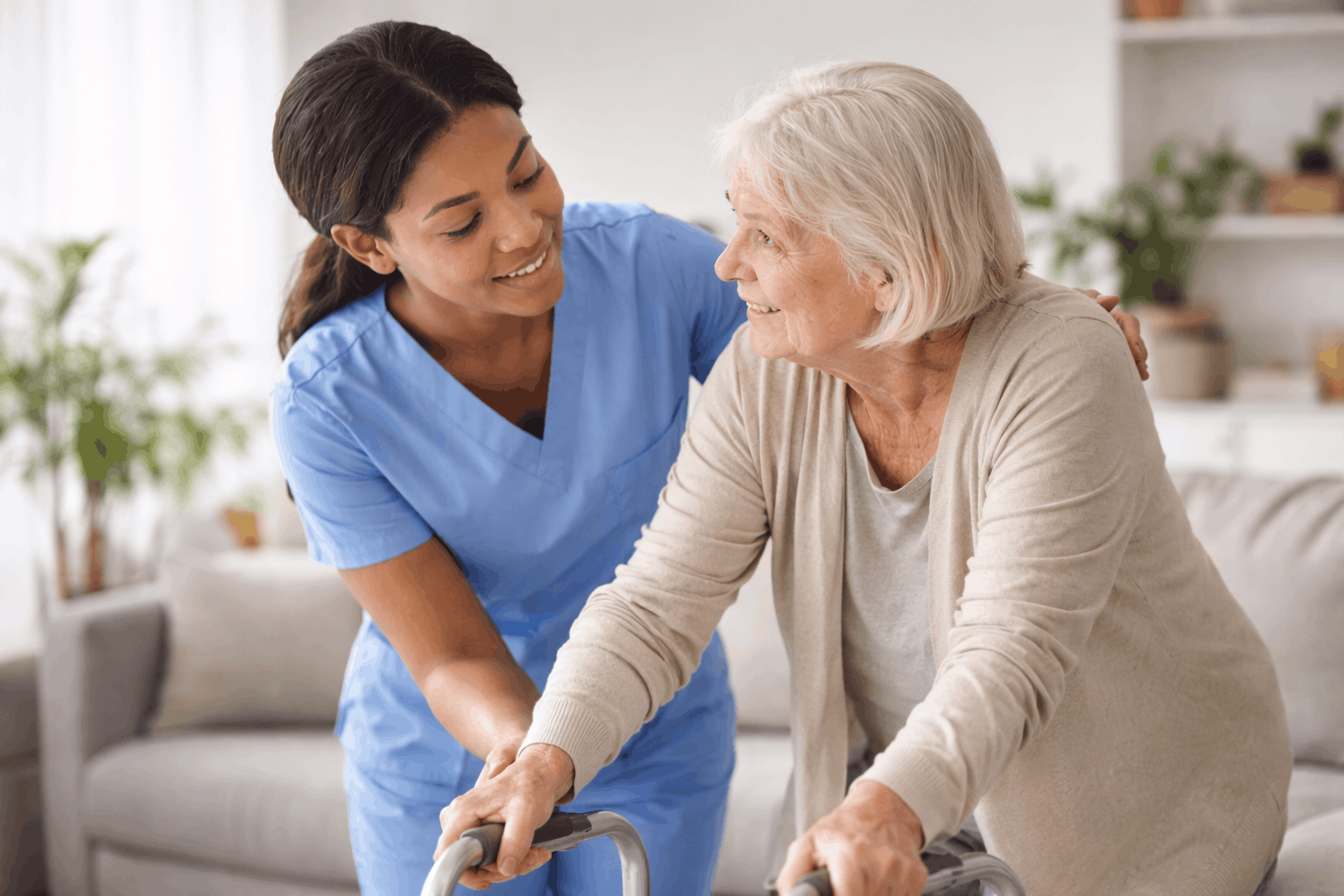 Caregiver assisting elderly woman